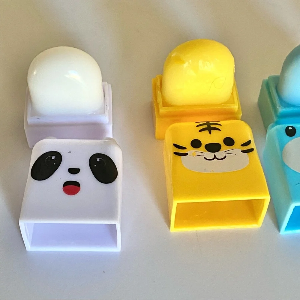 5/$25 Lip Balm 4pc animal set pink white blue and yellow scented fruits brand